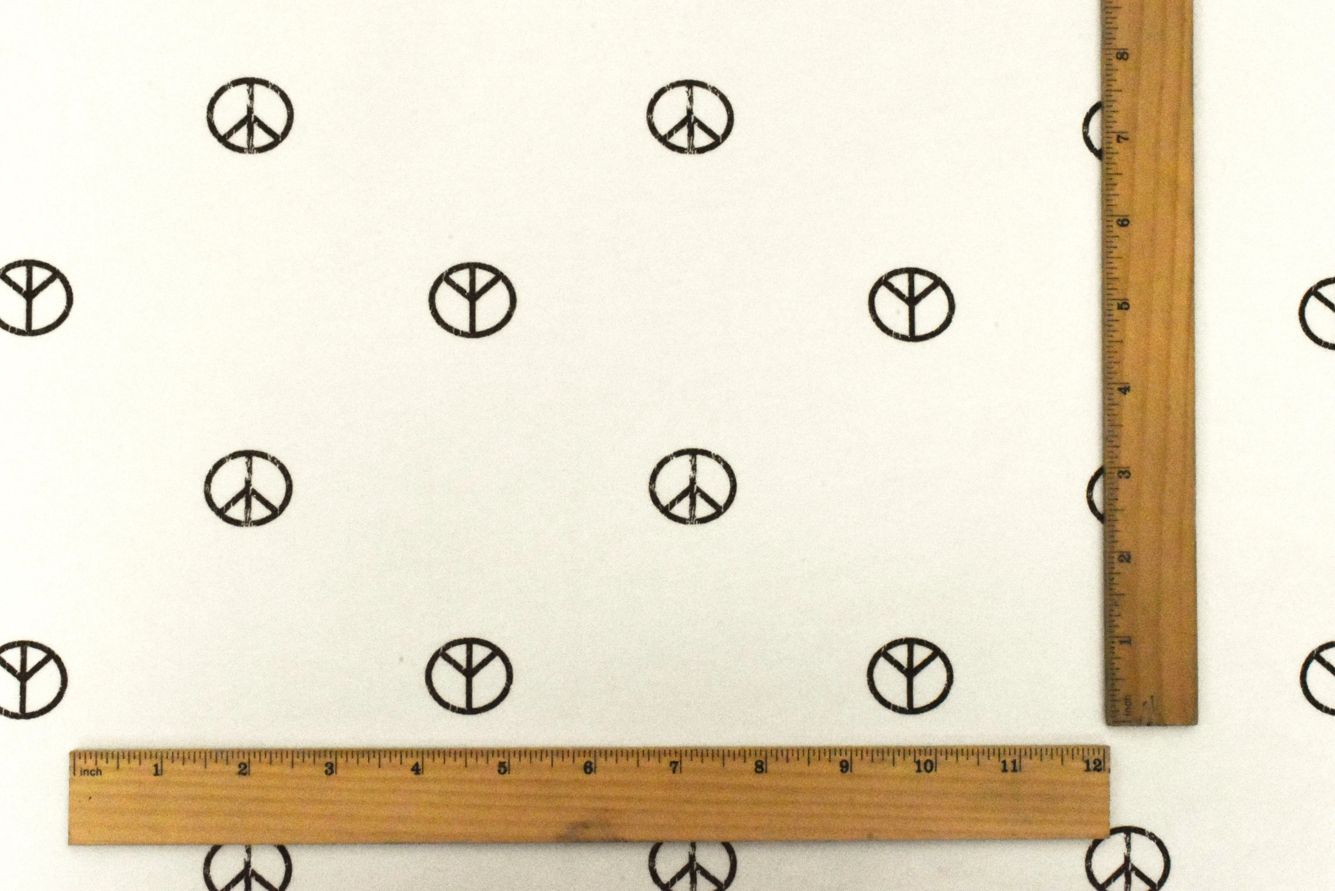 Ivory-Black Peace Printed Stretch Cotton French Terry Brush Fleece Fabric